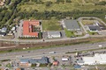 LÅE Fastighetsutveckling bebygger marken mellan de tre byggnaderna norr om E 20 (ovanför motorvägen i bild).